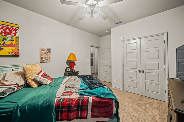 a bedroom with furniture and a bed