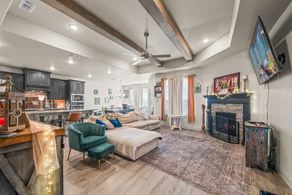 a living room with furniture and a fireplace