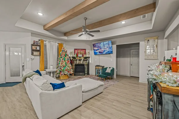 a kitchen with granite countertop a table chairs stove and cabinets