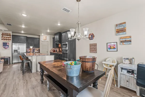 a kitchen with sink and view of living room