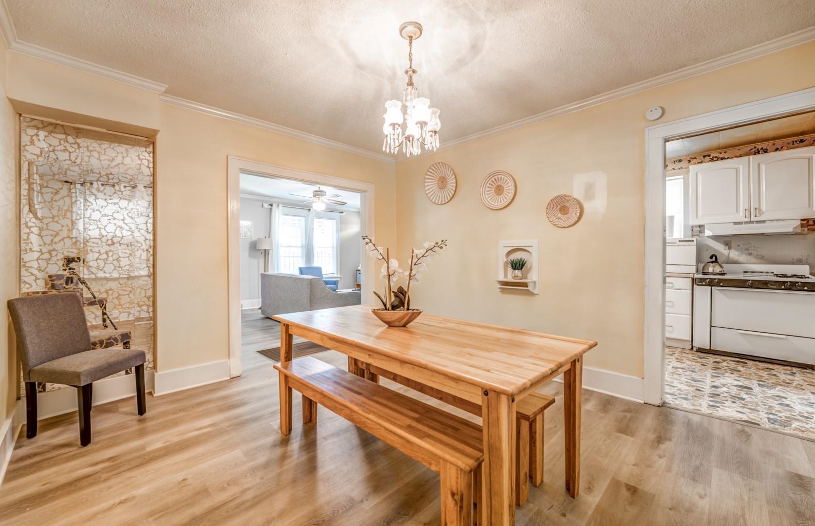 756 Garland Street Memphis, TN 38107 - Photo 17 of 35 a view of a dining room with furniture window and wooden floor