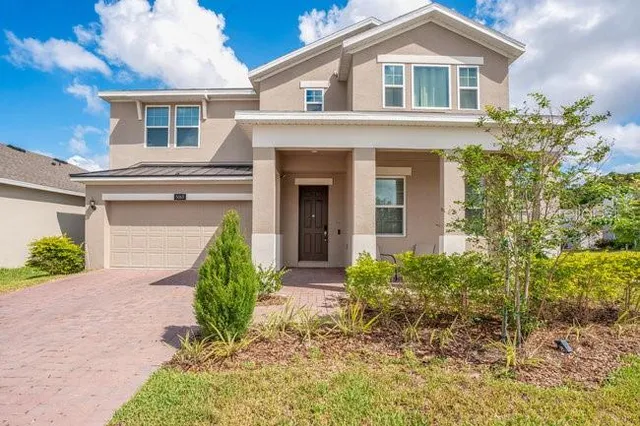 front view of a house with a yard