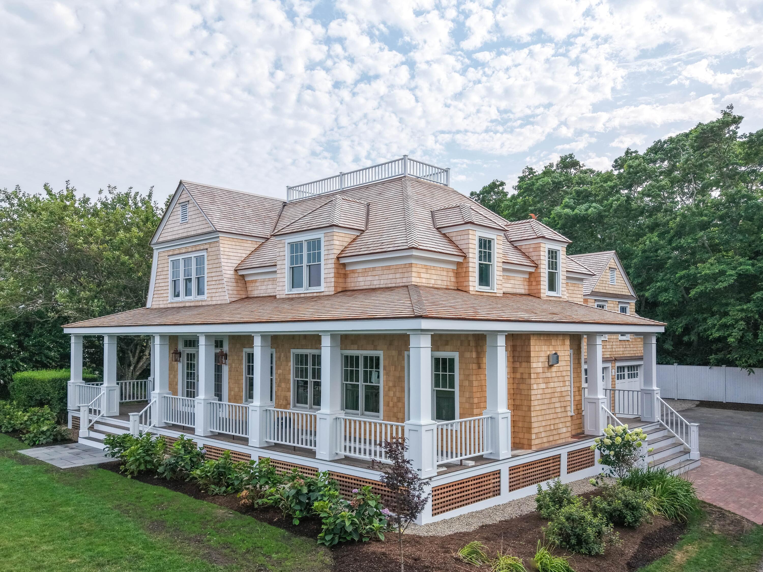 169 Shore Road Chatham, MA 02633 - Photo 2 of 16 a front view of a house with a yard
