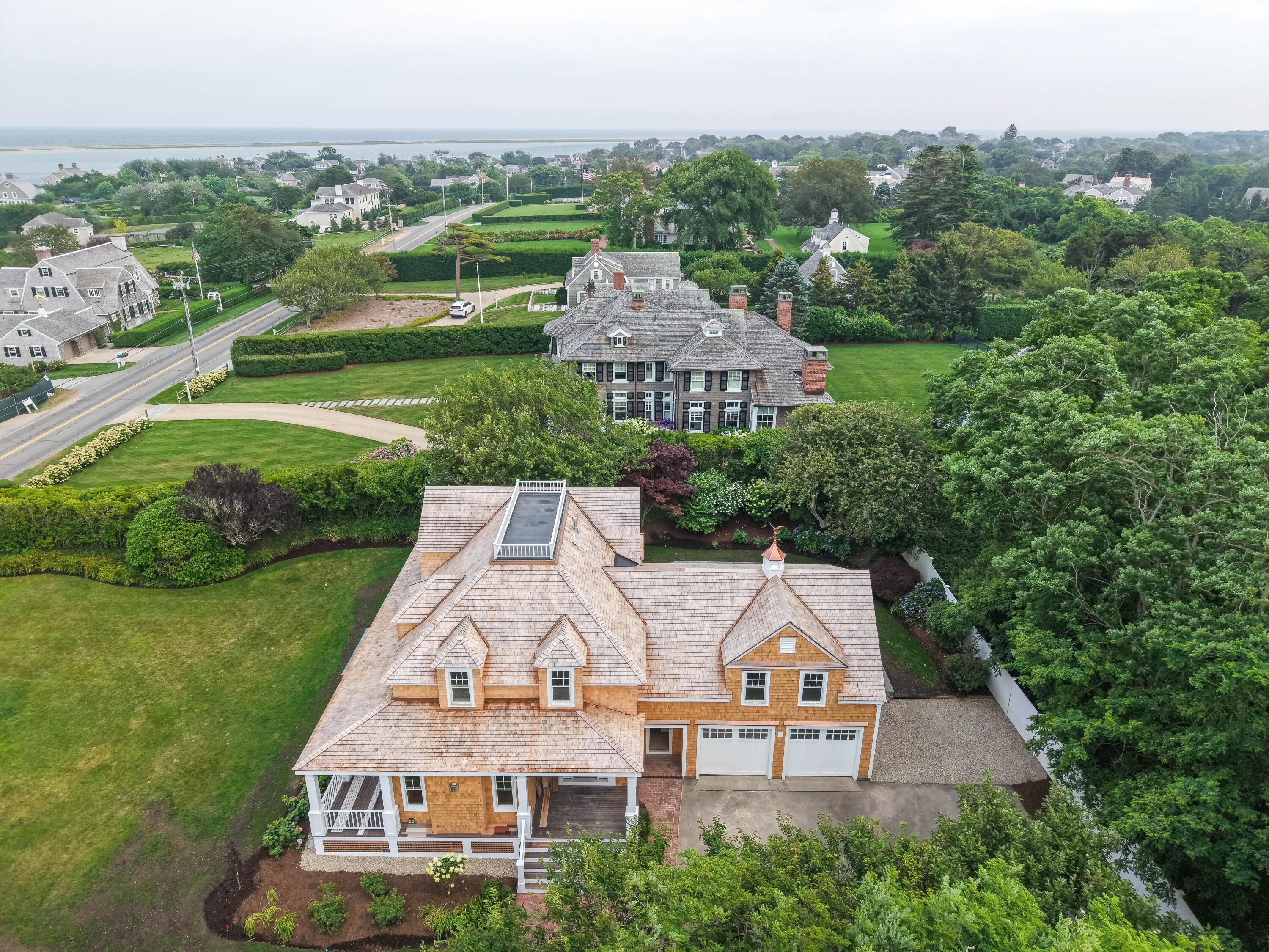169 Shore Road Chatham, MA 02633 - Photo 3 of 16 an aerial view of a house with a garden