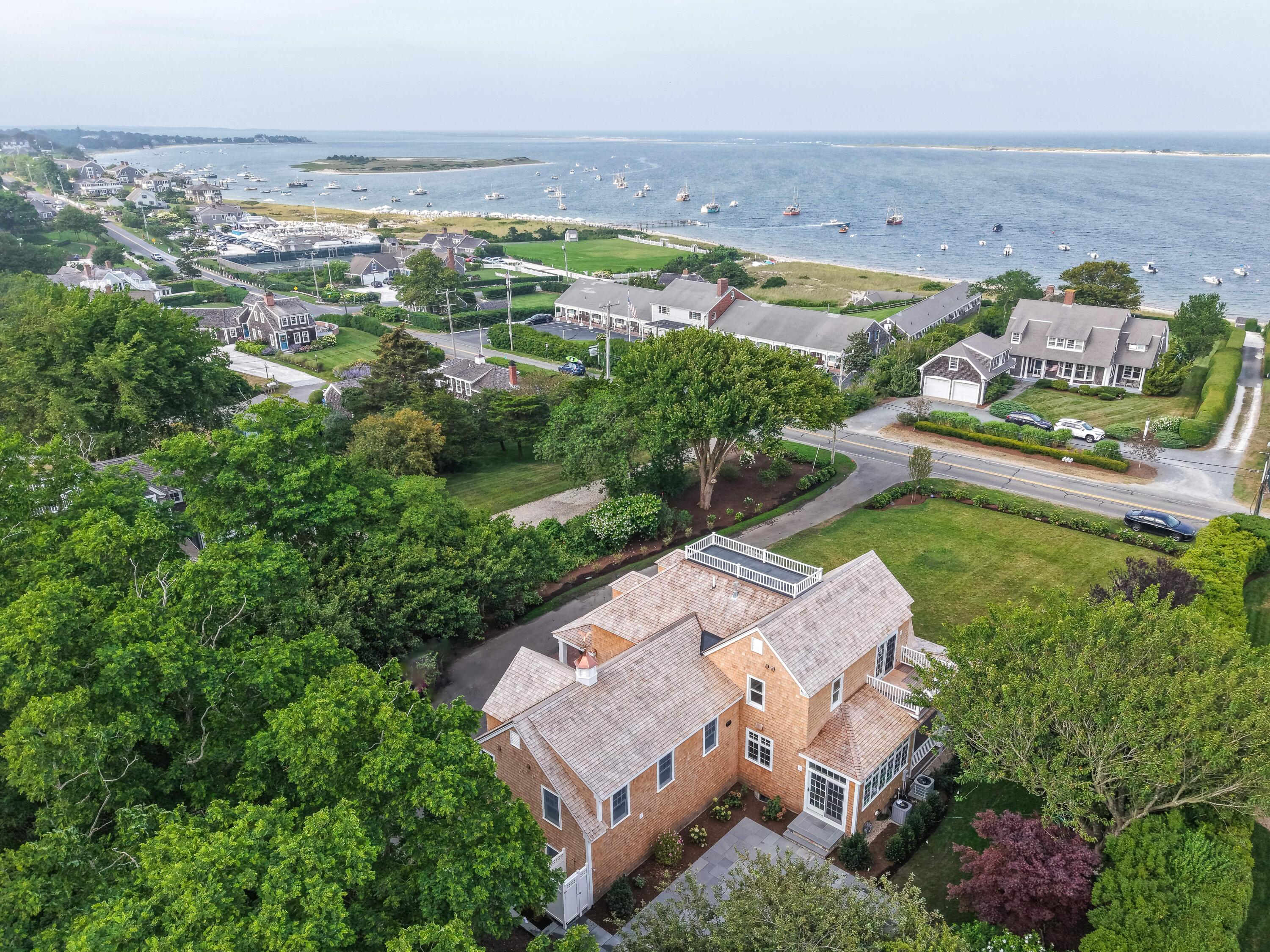 169 Shore Road Chatham, MA 02633 - Photo 4 of 16 an aerial view of a house with a garden