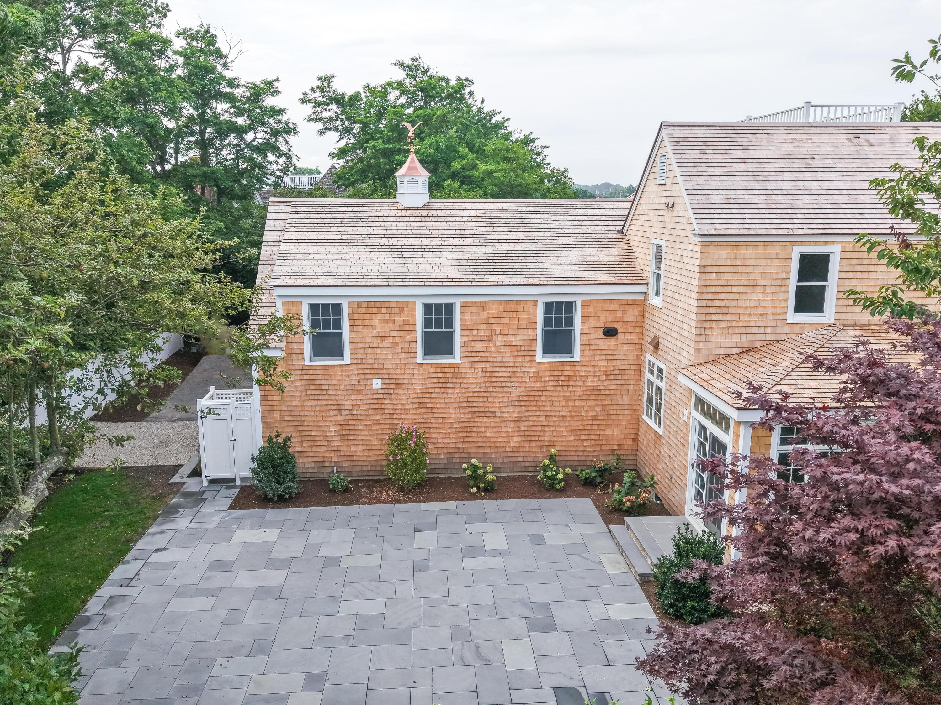 169 Shore Road Chatham, MA 02633 - Photo 5 of 16 a front view of a house with a garden