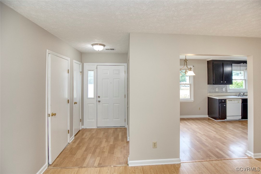7579 Bellehaven Drive Gloucester Point, VA 23062 - Photo 2 of 13 a view of a kitchen with a sink and a refrigerator
