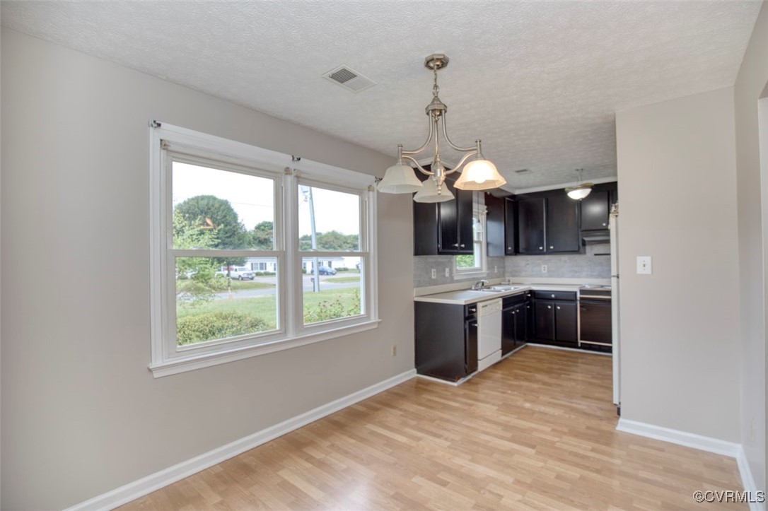 7579 Bellehaven Drive Gloucester Point, VA 23062 - Photo 5 of 13 a view of a kitchen with a sink stainless steel appliances and cabinets