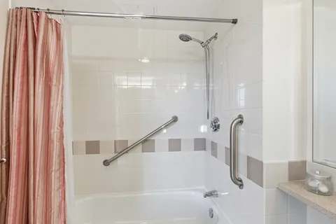 a bathroom with a shower and a sink