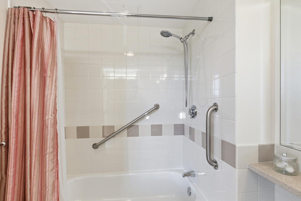 3 Repton Place, Unit 3204 Watertown, MA 02472 - Photo 11 of 18 a bathroom with a shower and a sink
