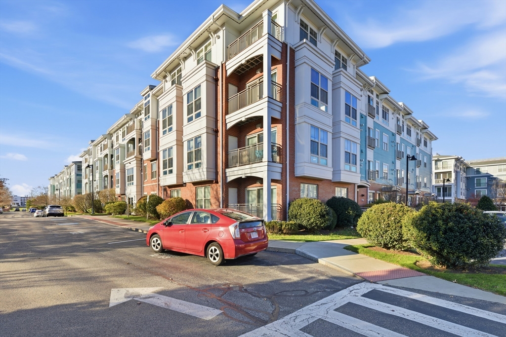 3 Repton Place, Unit 3204 Watertown, MA 02472 - Photo 16 of 18 a car parked in front of a building