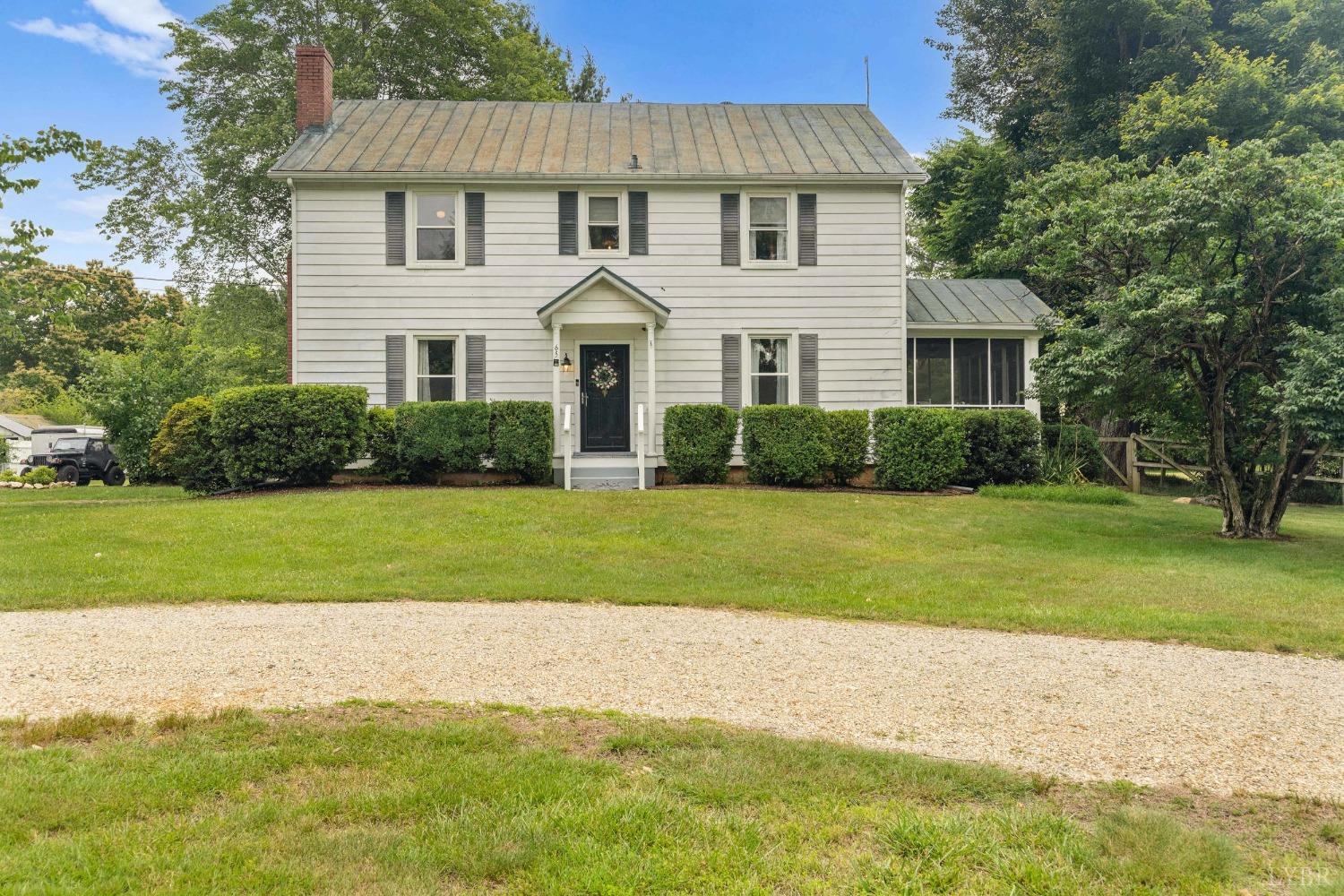 65 Phoenix Road Arrington, VA 22922 - Photo 1 of 58 a view of a white house with a yard and plants