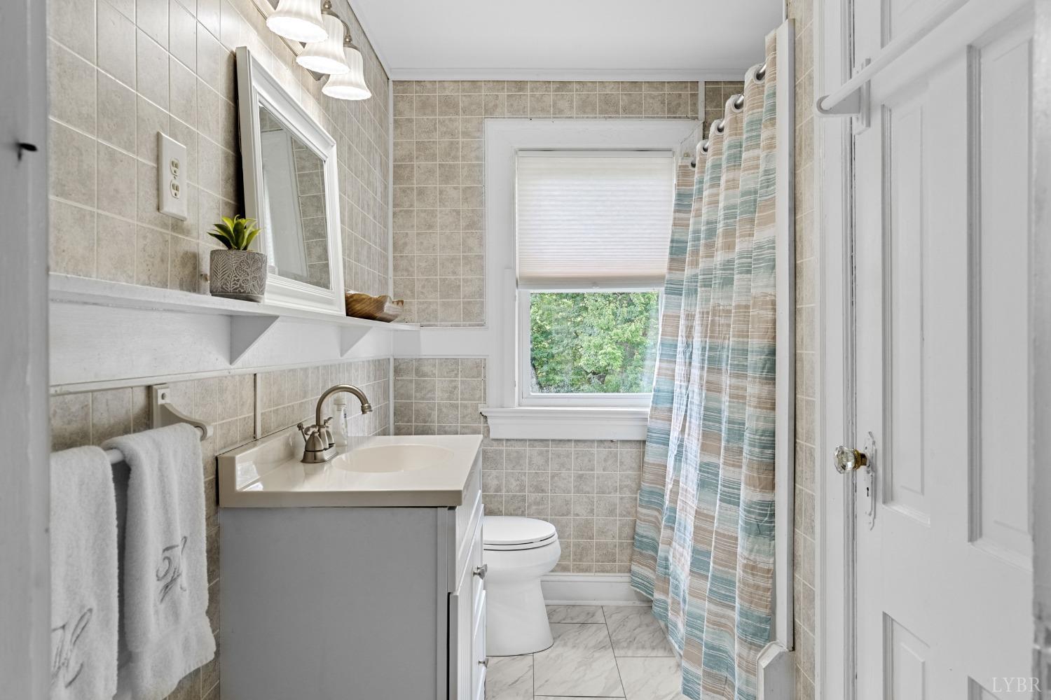 65 Phoenix Road Arrington, VA 22922 - Photo 28 of 58 a bathroom with a sink toilet and shower