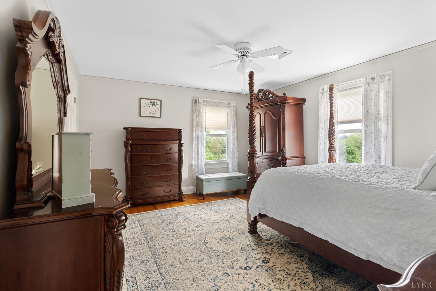 65 Phoenix Road Arrington, VA 22922 - Photo 29 of 58 a bedroom with a bed dresser and a flat tv screen