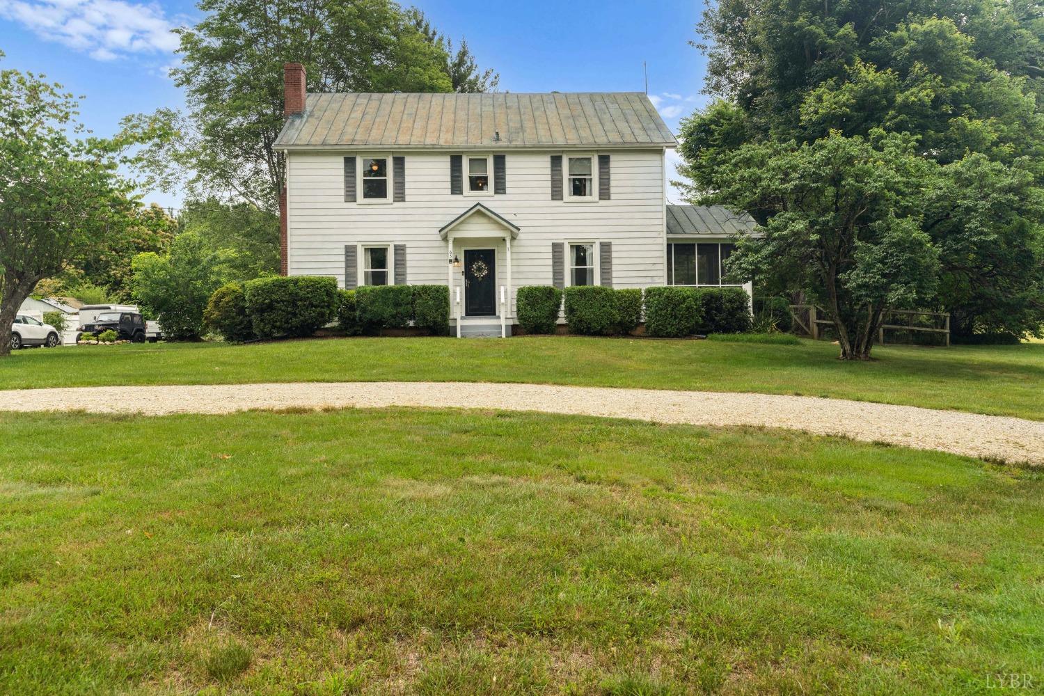 65 Phoenix Road Arrington, VA 22922 - Photo 3 of 58 a view of a white house with a big yard and large trees