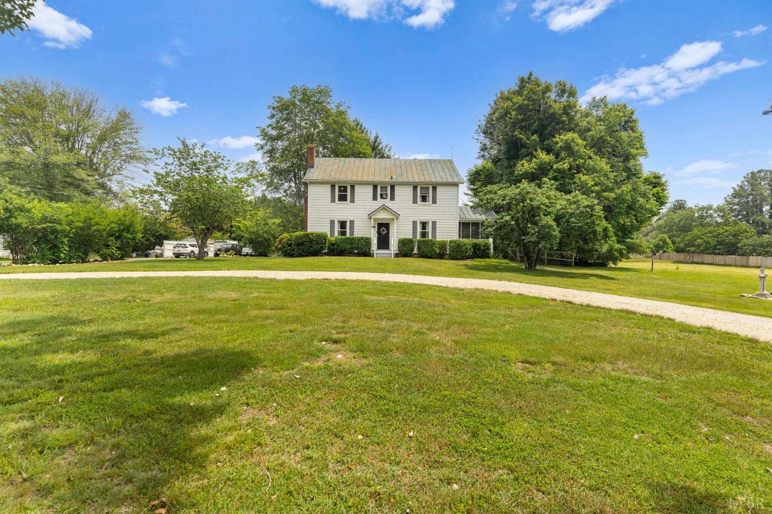 65 Phoenix Road Arrington, VA 22922 - Photo 4 of 58 a view of a big house with a big yard and palm trees