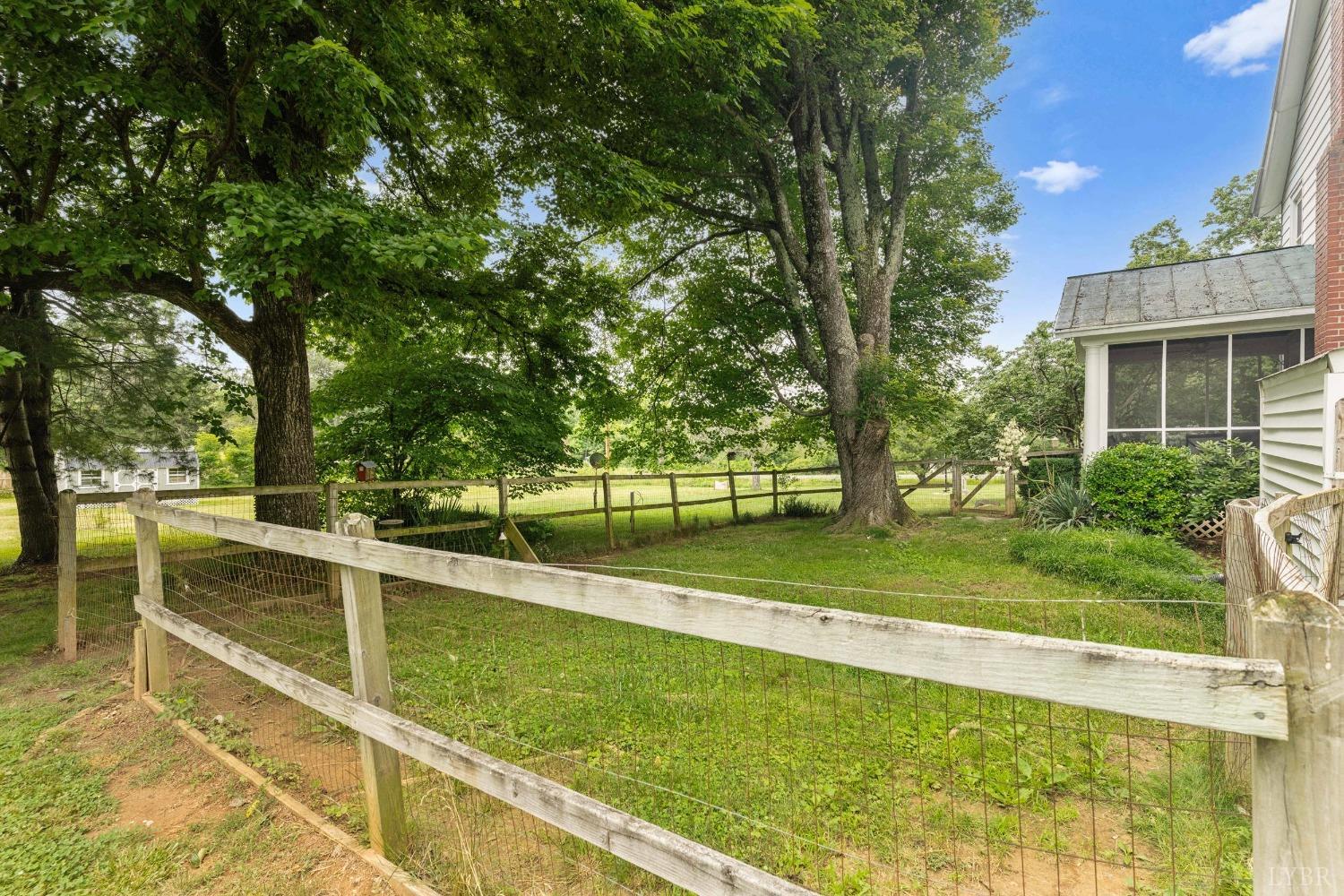65 Phoenix Road Arrington, VA 22922 - Photo 56 of 58 a view of a swimming pool with a patio and a yard