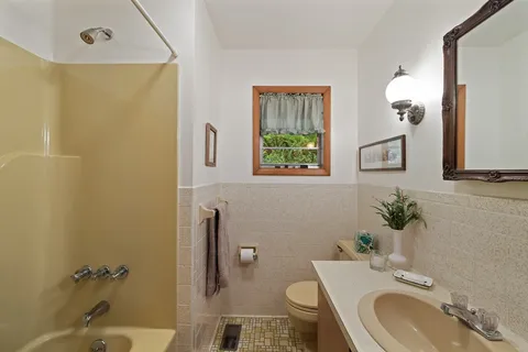 a bedroom with two beds and painted walls