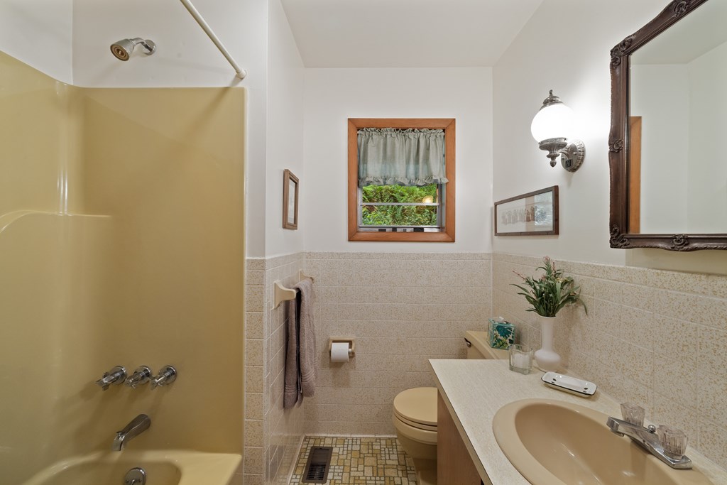 283 River Bend Lane Blue Ridge, GA 30513 - Photo 22 of 33 a bathroom with a granite countertop sink toilet and a mirror