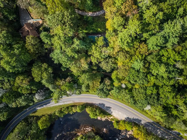 a view of house with a yard