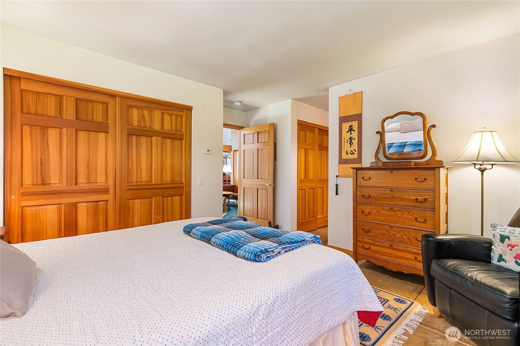 2490 Goshen Road Bellingham, WA 98226 - Photo 19 of 40 a bedroom with a bed and wooden floor