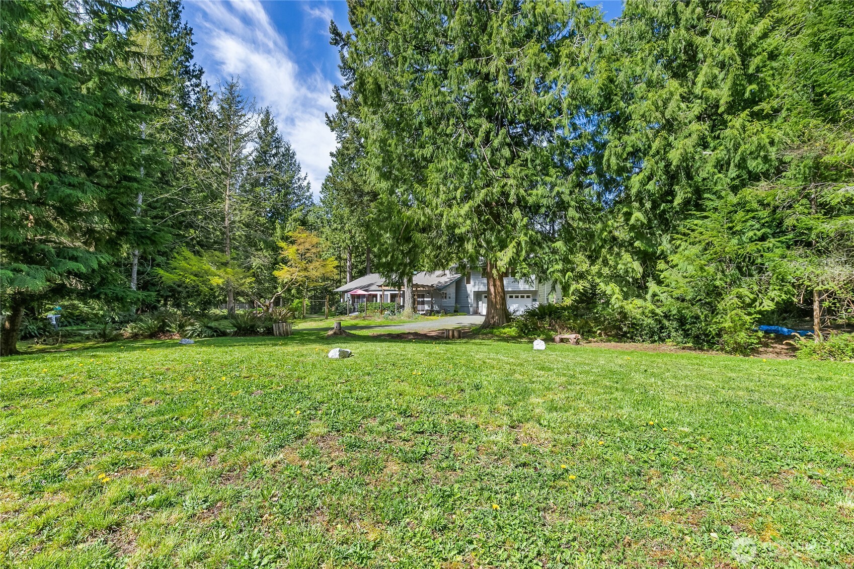 2490 Goshen Road Bellingham, WA 98226 - Photo 35 of 40 a green field with trees in the background
