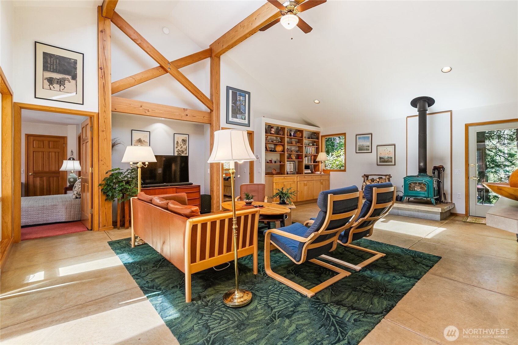 2490 Goshen Road Bellingham, WA 98226 - Photo 5 of 40 a living room with furniture gym equipment and large windows