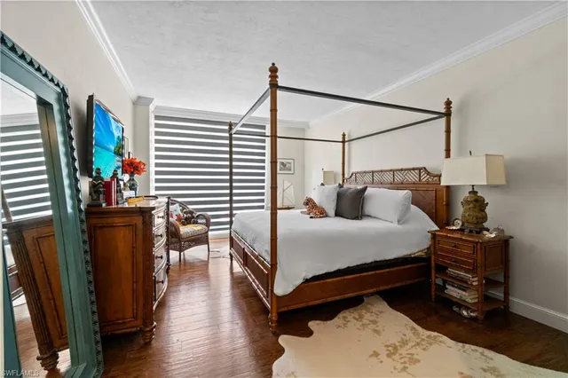 a bed room with a bed and a lamp