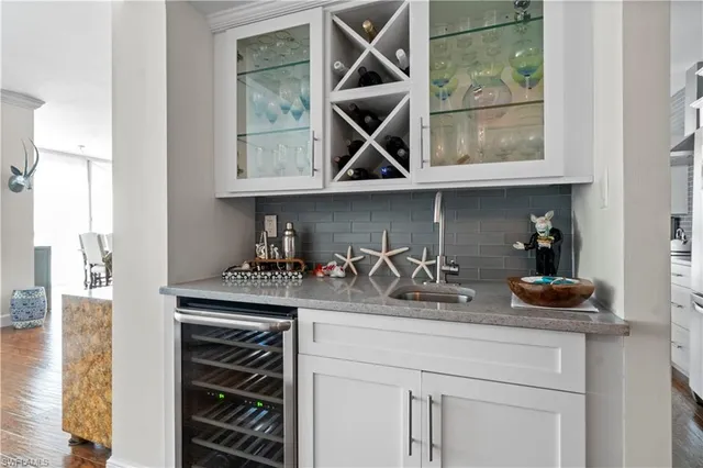a view of a house with pool and sitting area