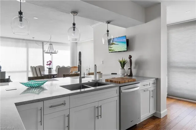 a view of a dining room with furniture and chandelier