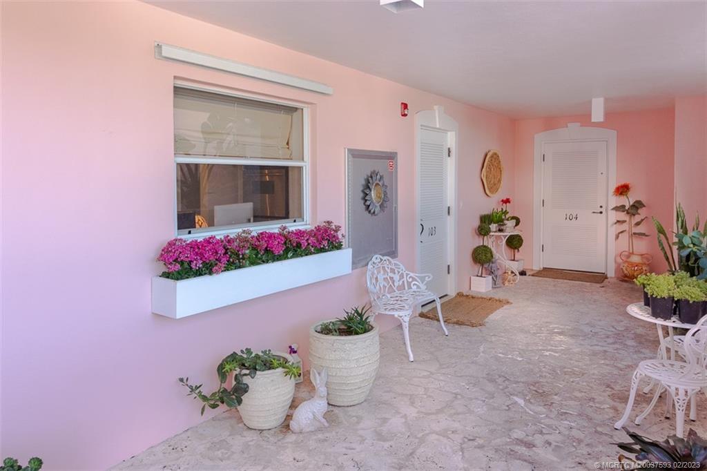 1701 Northeast Ocean Boulevard, Unit 103 Stuart, FL 34996 - Photo 35 of 46 a living room with furniture