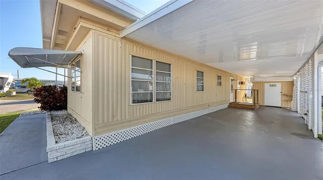 a view of a hallway with wooden floor and fence