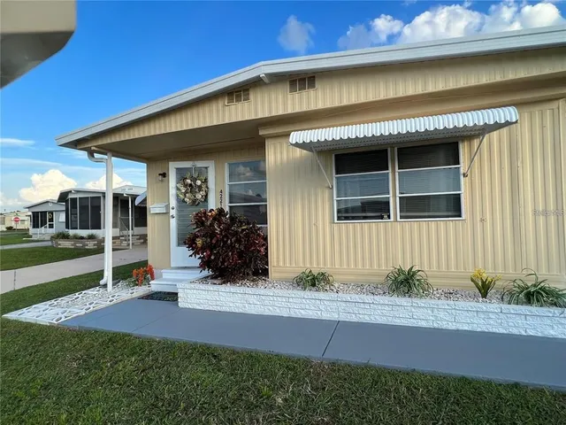 a view of a patio with swimming pool table and chairs