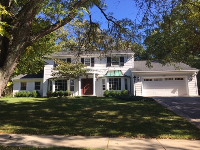 1029 Timber Lane Lake Forest, IL 60045 - Photo 1 of 1 a front view of a house with a garden