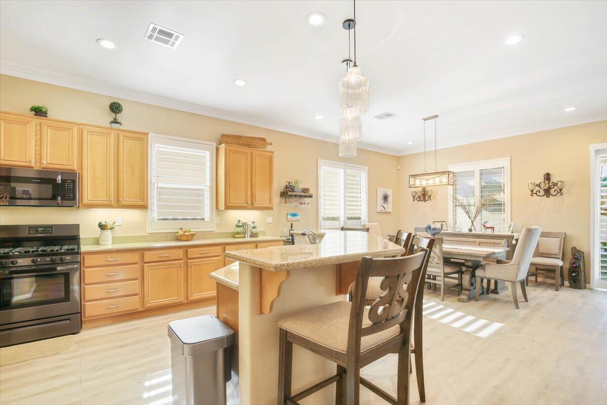 49465 Lewis Road Indio, CA 92201 - Photo 12 of 30 a large kitchen with a table and chairs
