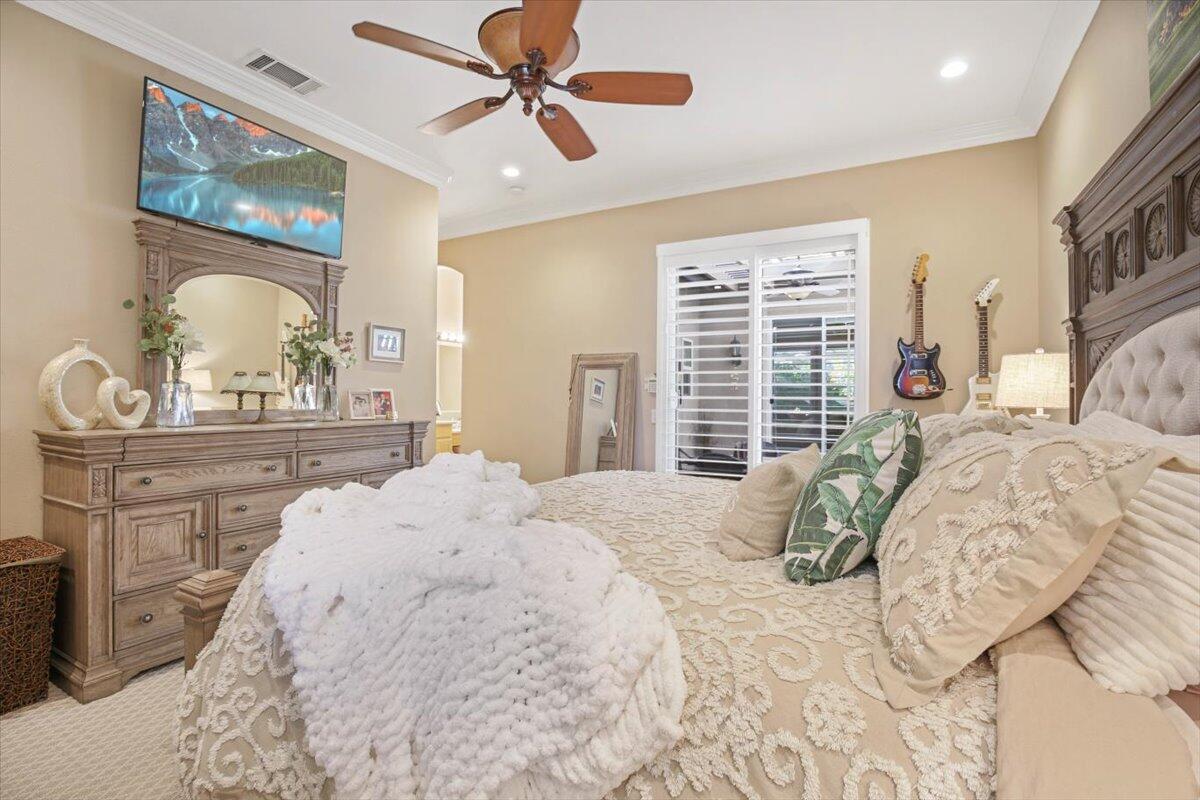 49465 Lewis Road Indio, CA 92201 - Photo 14 of 30 a bedroom with a large bed and a window