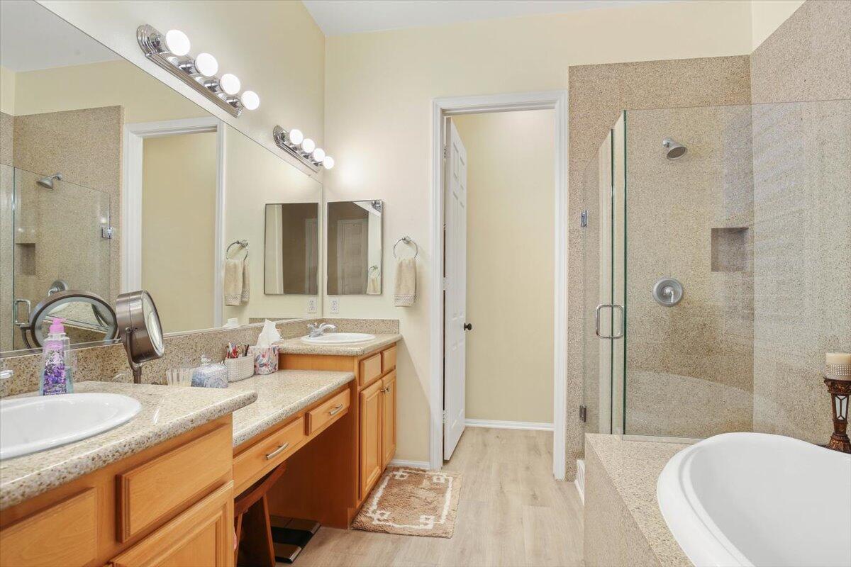 49465 Lewis Road Indio, CA 92201 - Photo 16 of 30 a bathroom with a sink double vanity granite tub shower and a mirror