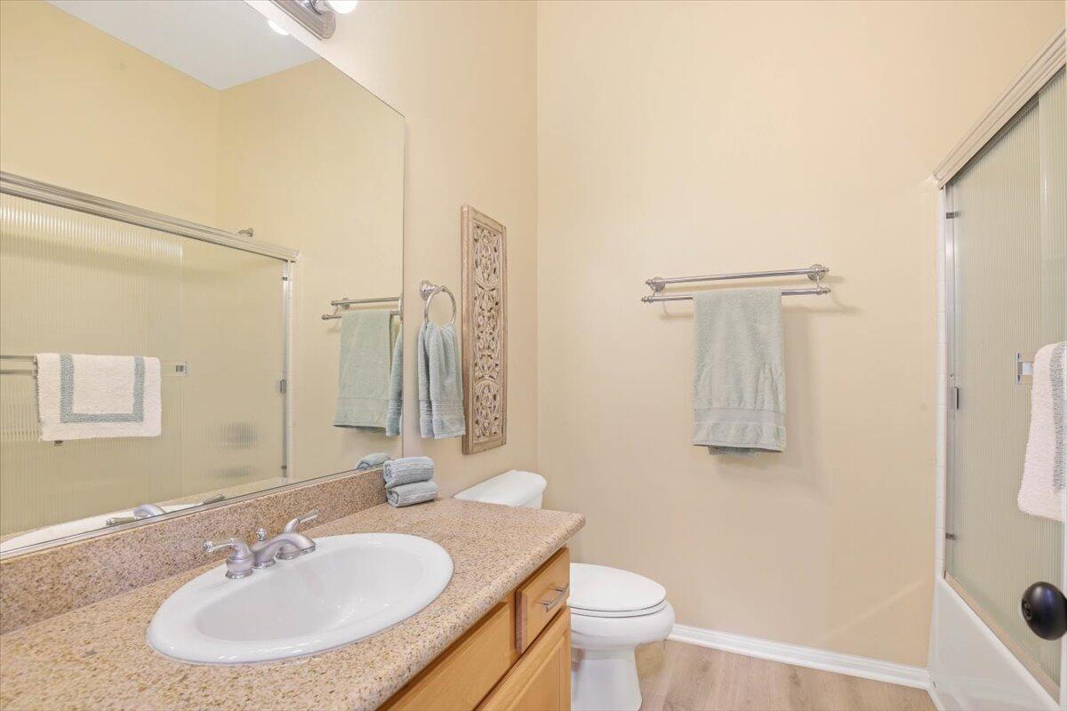 49465 Lewis Road Indio, CA 92201 - Photo 19 of 30 a bathroom with a toilet sink and mirror
