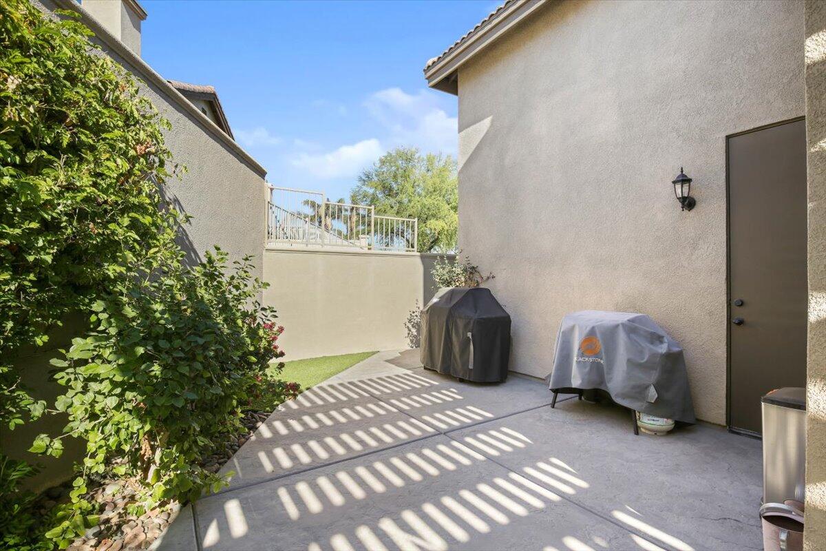 49465 Lewis Road Indio, CA 92201 - Photo 24 of 30 a bedroom with a bed and a window