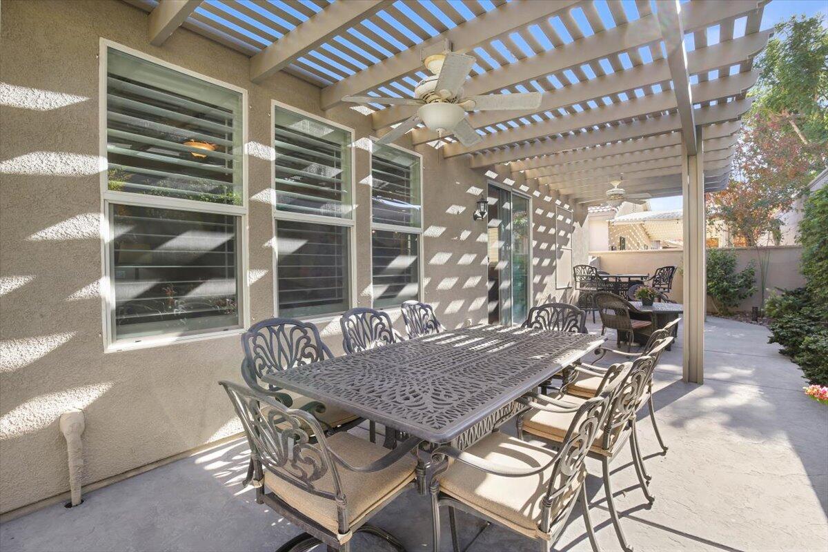 49465 Lewis Road Indio, CA 92201 - Photo 25 of 30 a view of a patio with a table and chairs