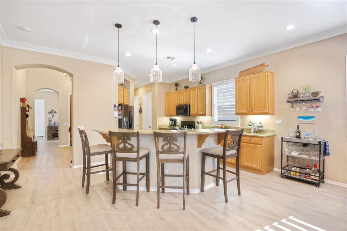 49465 Lewis Road Indio, CA 92201 - Photo 3 of 30 a large kitchen with a table and chairs