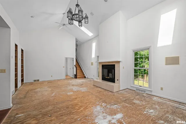 a view of a bedroom with closet and windows