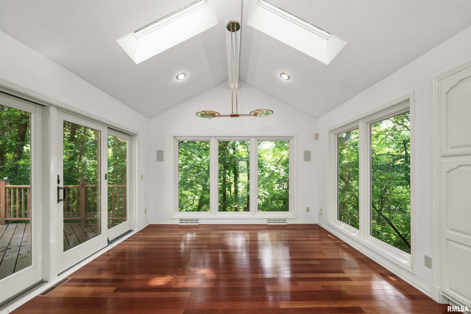 5 White Oak Court Moline, IL 61265 - Photo 23 of 57 a view of an empty room with wooden floor and a window