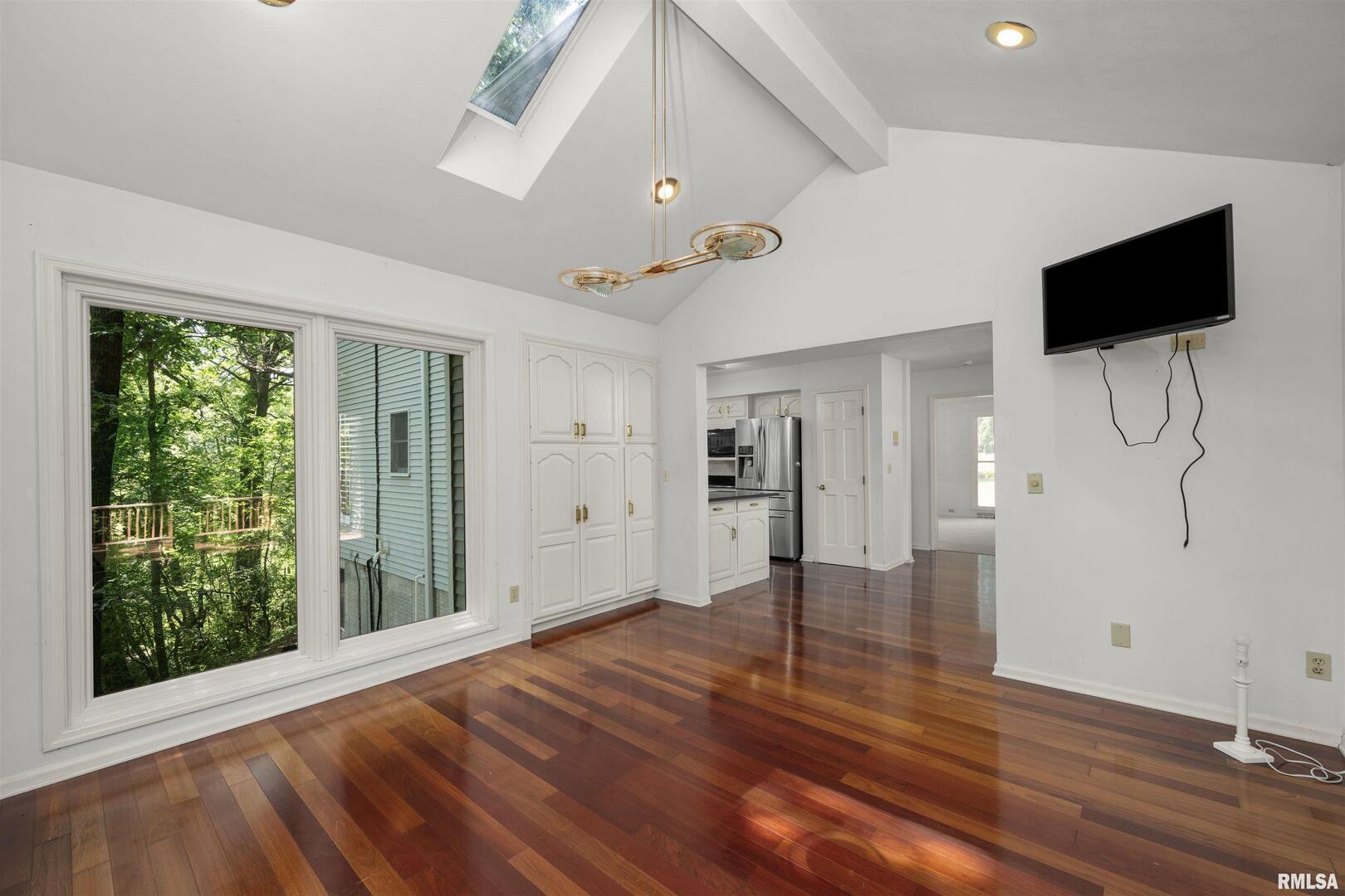 5 White Oak Court Moline, IL 61265 - Photo 24 of 57 a view of an empty room with wooden floor and a window