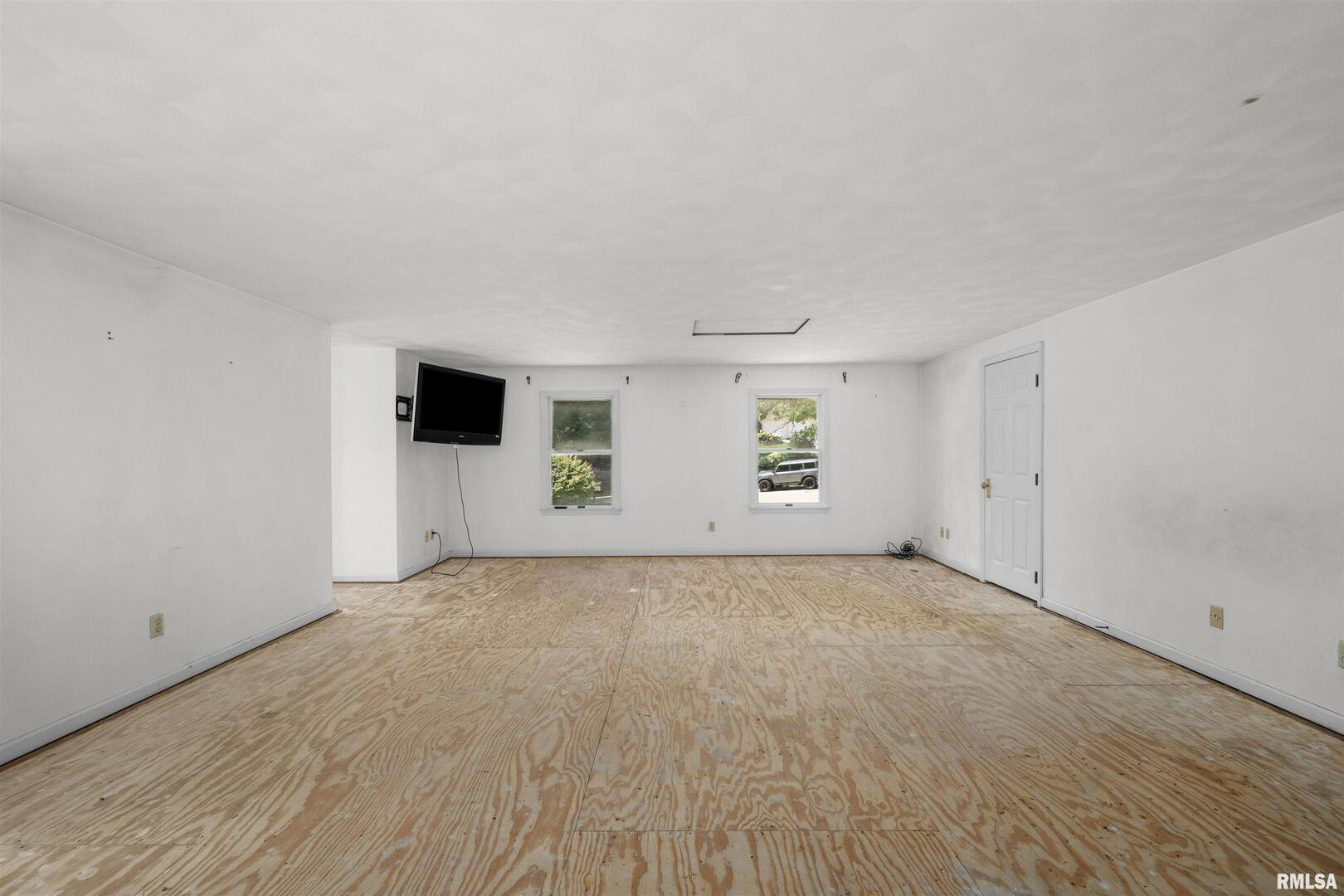 5 White Oak Court Moline, IL 61265 - Photo 26 of 57 a view of an empty room with a fireplace and a window