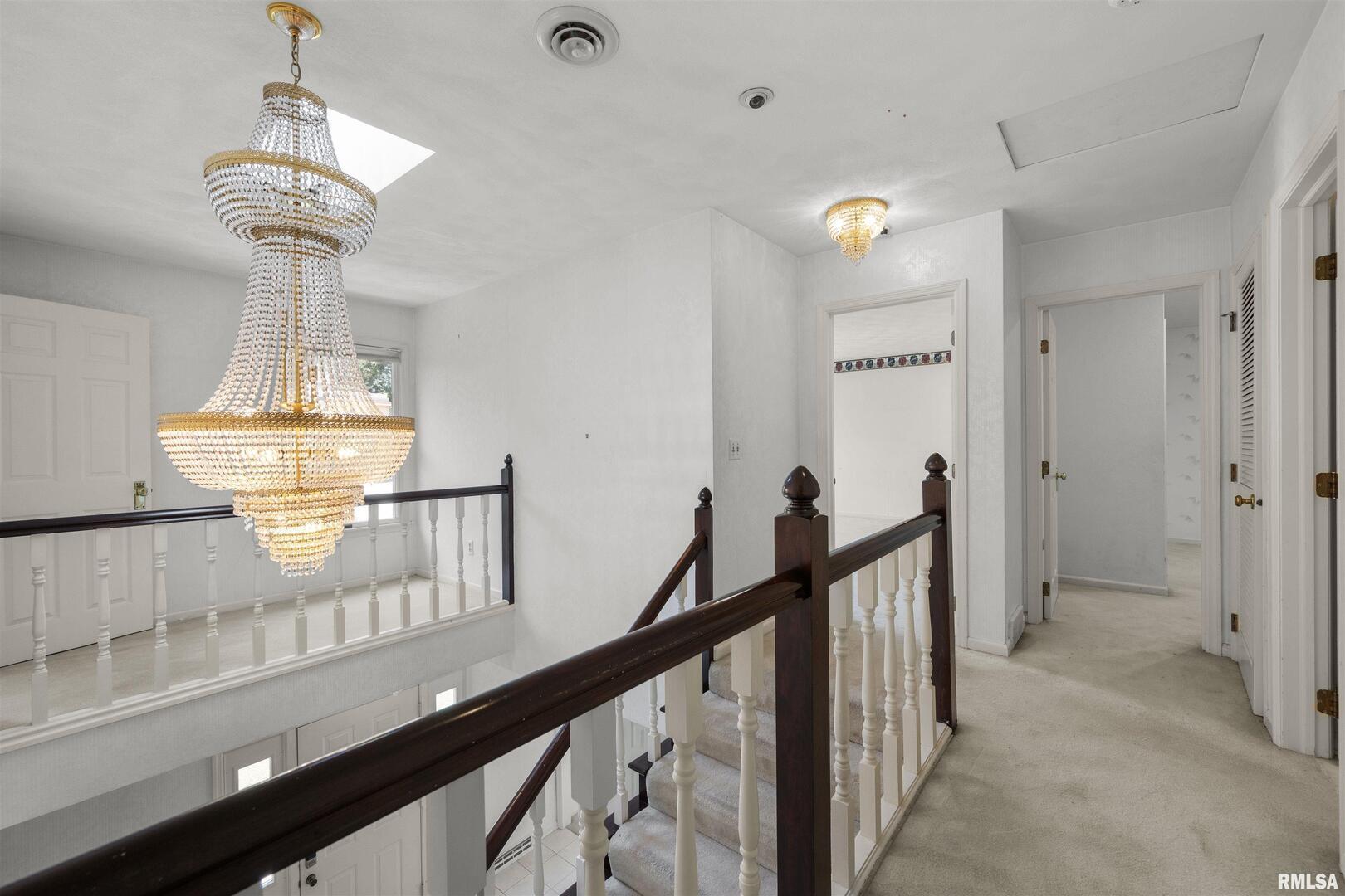 5 White Oak Court Moline, IL 61265 - Photo 32 of 57 a view of a hallway view with staircase