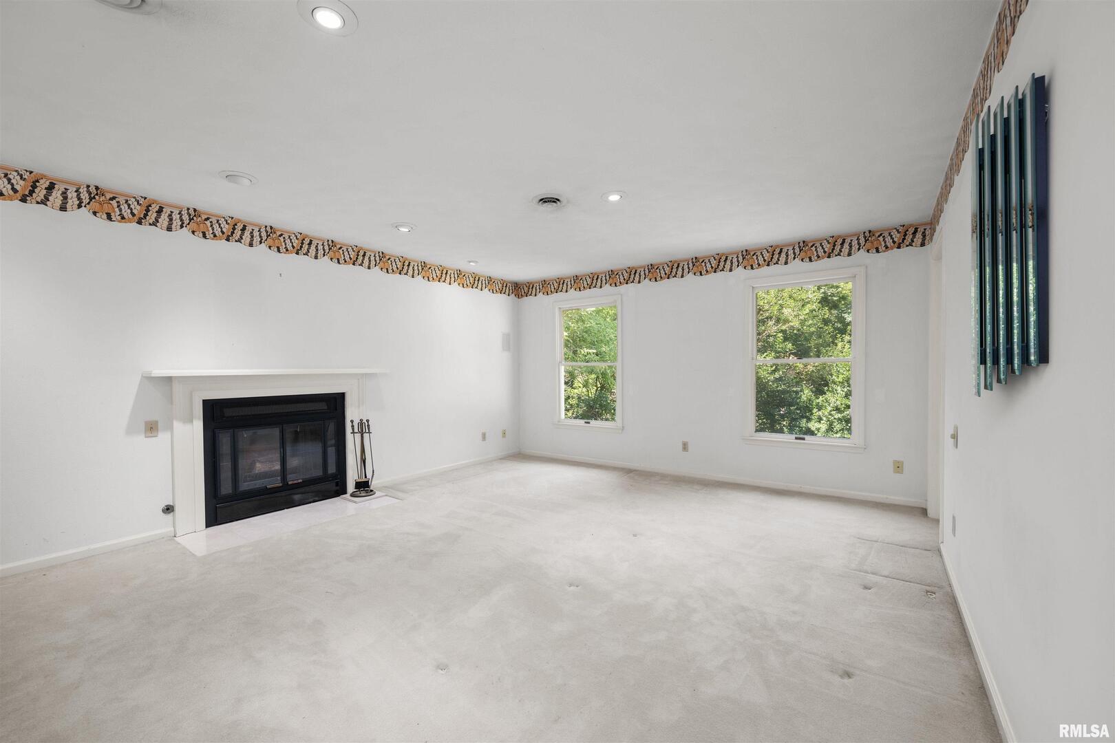 5 White Oak Court Moline, IL 61265 - Photo 34 of 57 an empty room with windows and fireplace