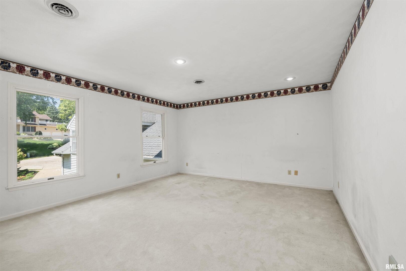 5 White Oak Court Moline, IL 61265 - Photo 35 of 57 an empty room with windows