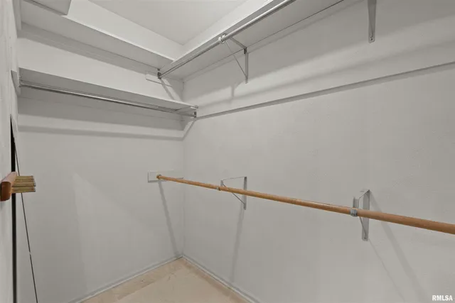 a big room with closet and windows