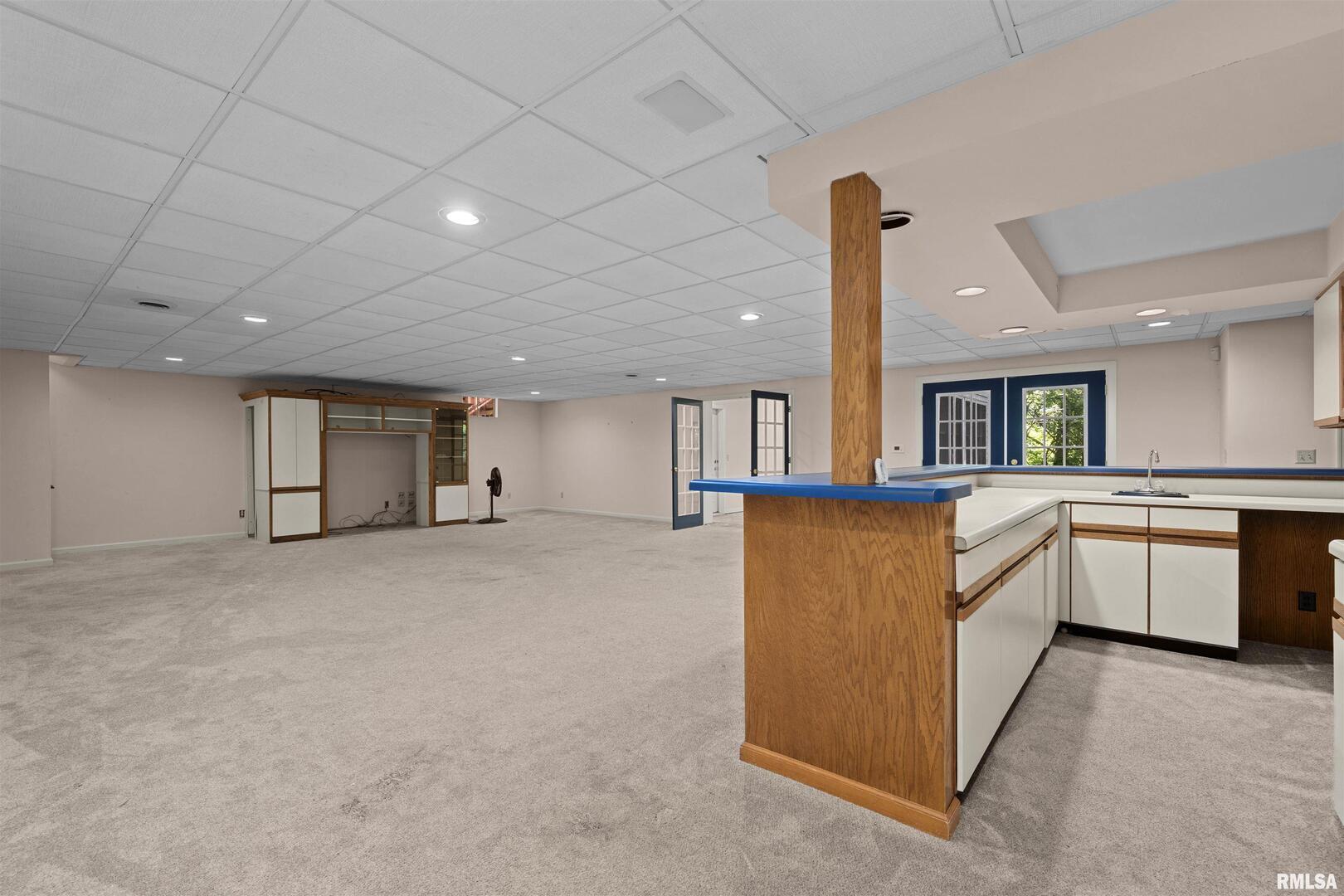 5 White Oak Court Moline, IL 61265 - Photo 46 of 57 a large kitchen with stainless steel appliances granite countertop a large counter top and a stove